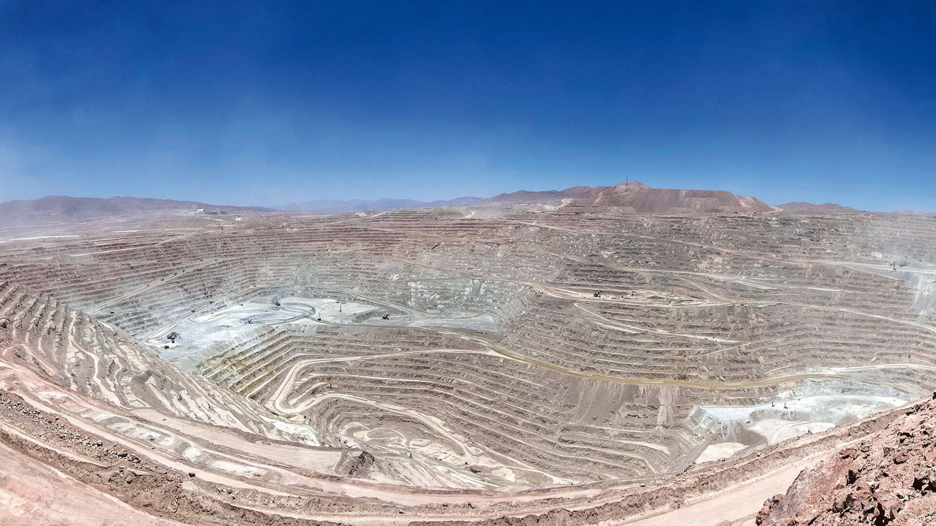 Wide panoramic view of Escondida copper mine in Chile’s Atacama Desert.